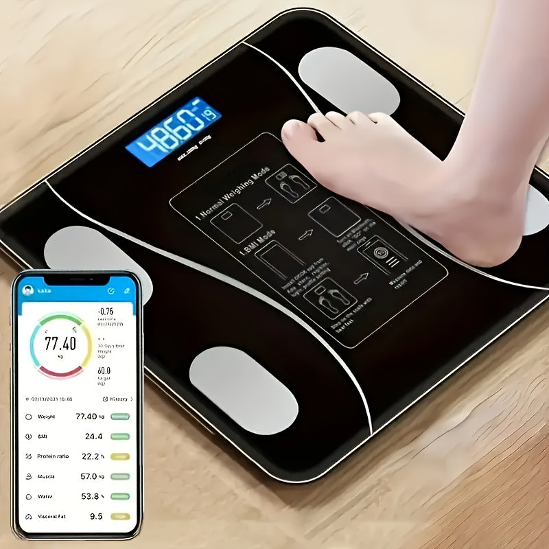 Digital body fat scale with a smartphone app displaying health metrics on a wooden floor.