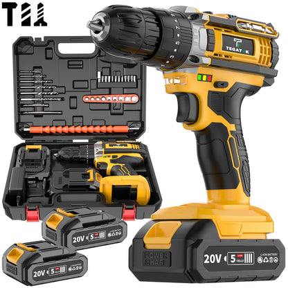 Yellow cordless drill with accessories and batteries on a white background