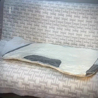 Bed with a patterned headboard and bedding