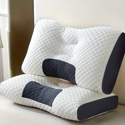 White and black wedge-shaped pillow on a light surface