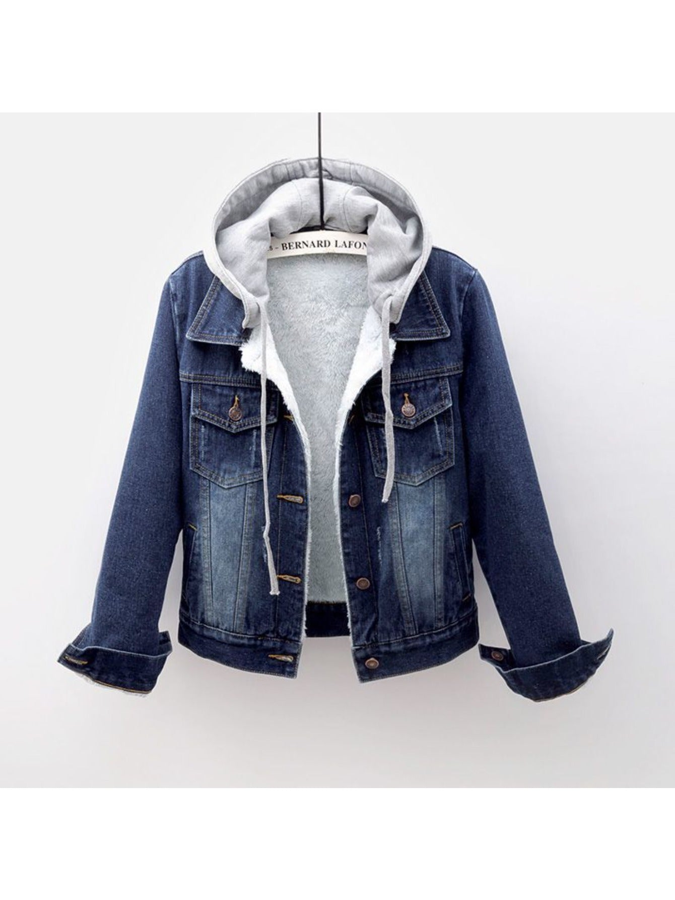 Blue denim jacket with gray hoodie on a white background