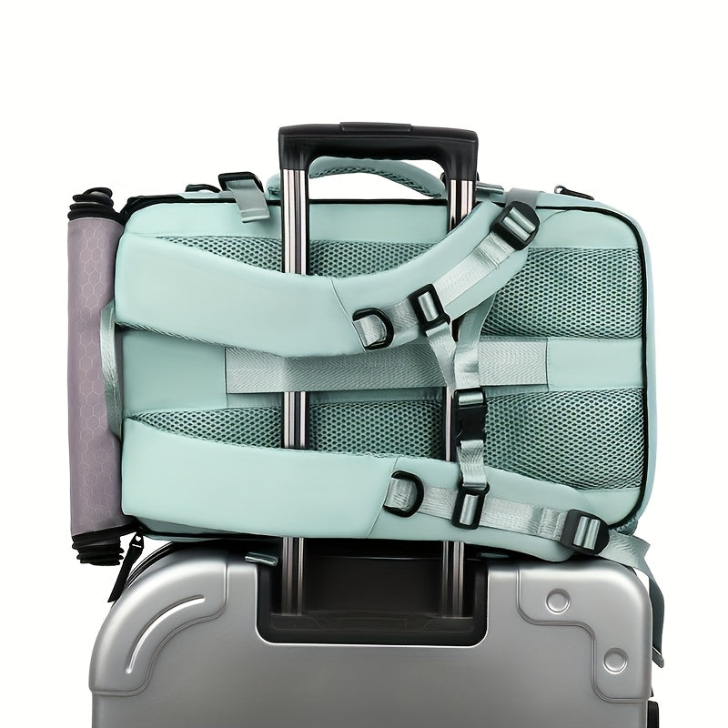 Light blue backpack with straps over a silver suitcase on a white background